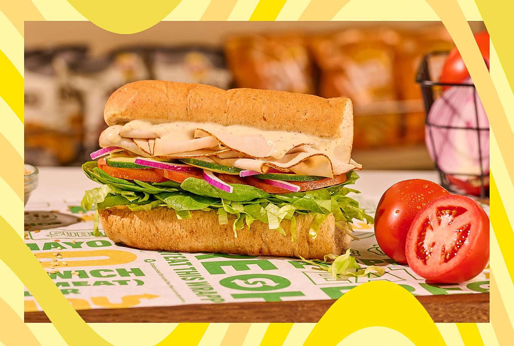 A close-up photo of a Subway-style sandwich with fresh fillings.